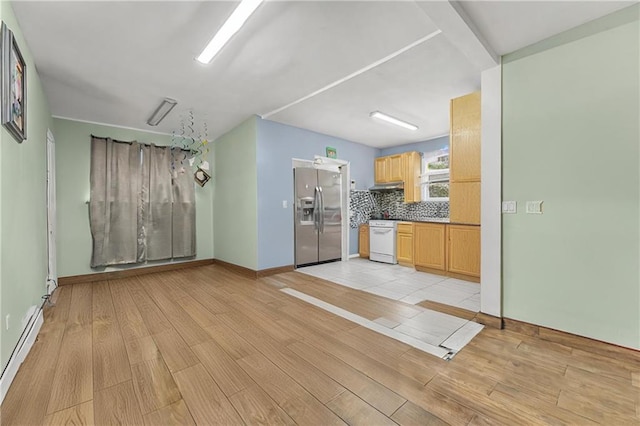 kitchen with backsplash, a baseboard heating unit, light wood-style floors, and stainless steel fridge with ice dispenser