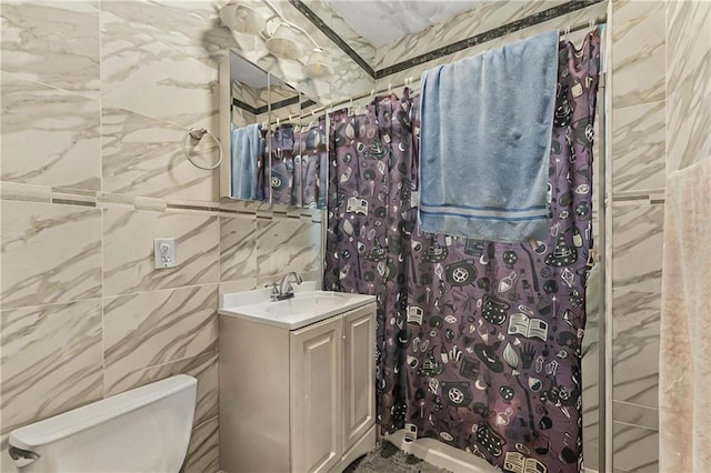 bathroom featuring vanity, tile walls, toilet, and a shower with shower curtain