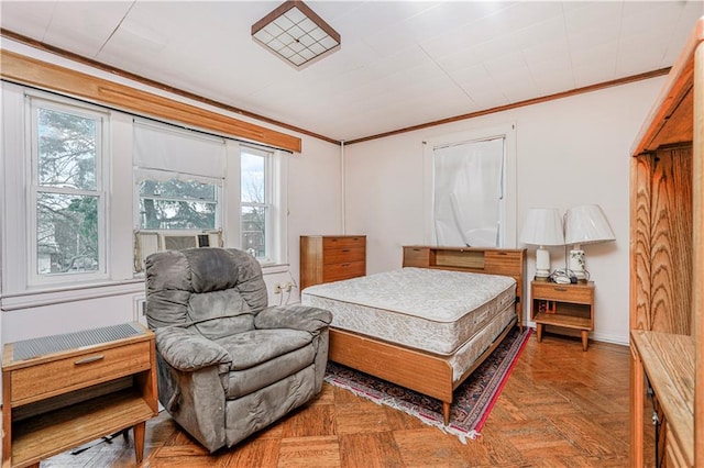 bedroom with baseboards and ornamental molding