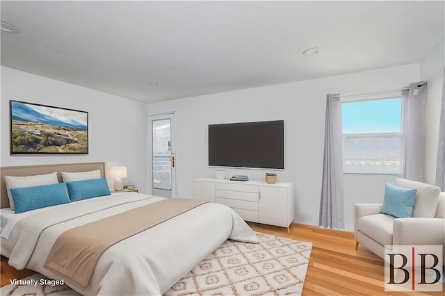 bedroom featuring light wood-style flooring