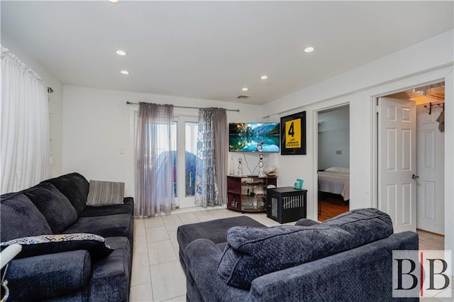 living area featuring recessed lighting and visible vents