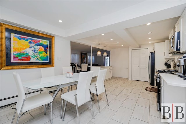 dining space featuring recessed lighting