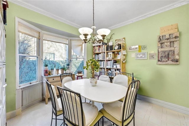 dining space with baseboards, an inviting chandelier, ornamental molding, and radiator heating unit