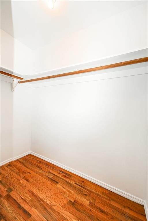 spacious closet with wood finished floors