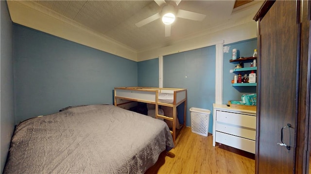 bedroom with light wood-style floors and ceiling fan