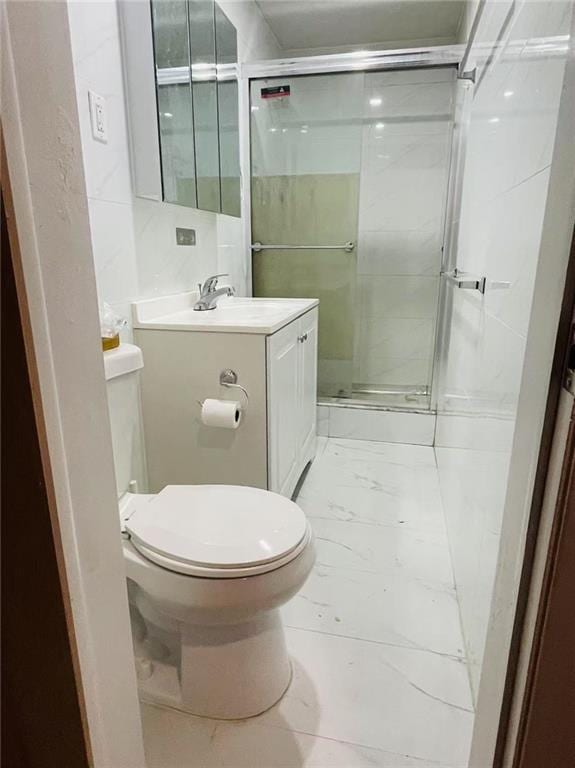 9 Corso Ct, Brooklyn, NY 11223 - full bath featuring marble look tile flooring, toilet, a stall shower, and vanity