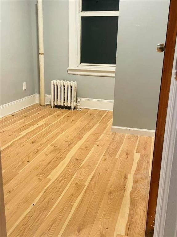 9 Corso Ct, Brooklyn, NY 11223 - spare room with radiator, wood finished floors, and baseboards