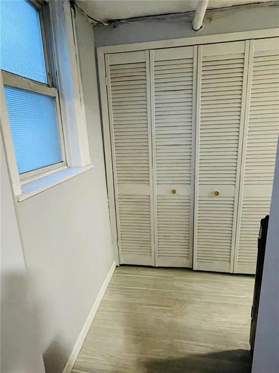 9 Corso Ct, Brooklyn, NY 11223 - detailed view of baseboards and wood finished floors