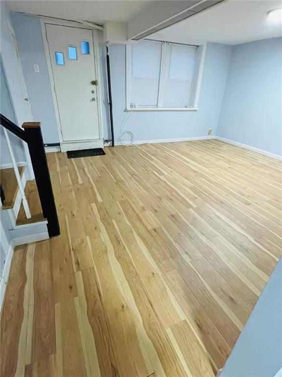 9 Corso Ct, Brooklyn, NY 11223 - entrance foyer with light wood-style flooring, stairway, and baseboards