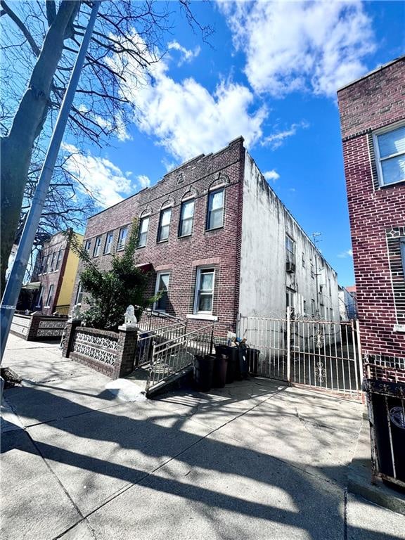 view of building exterior with fence