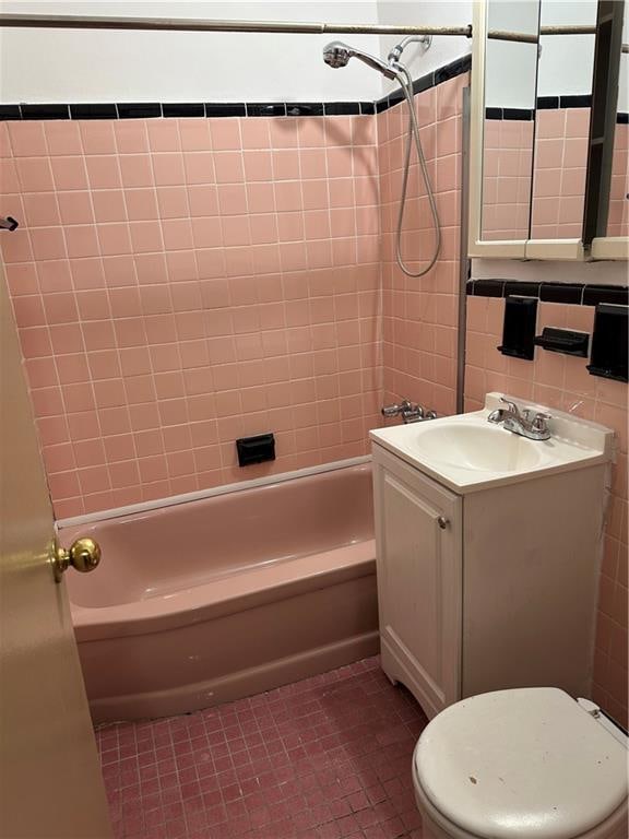 2665 Homecrest Ave Unit 6M, Brooklyn, NY 11235 - bathroom with vanity, shower / bath combination, tile patterned floors, toilet, and tile walls