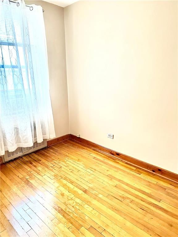2665 Homecrest Ave Unit 6M, Brooklyn, NY 11235 - spare room featuring light wood-type flooring and a baseboard heating unit