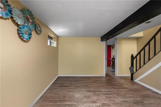 interior space featuring stairs, wood finished floors, and baseboards