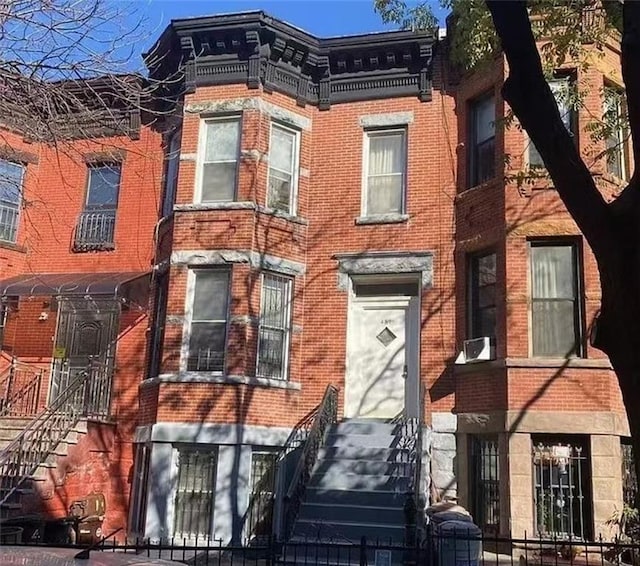 view of front of home featuring brick siding