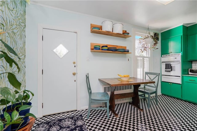 dining area featuring an inviting chandelier and ornamental molding