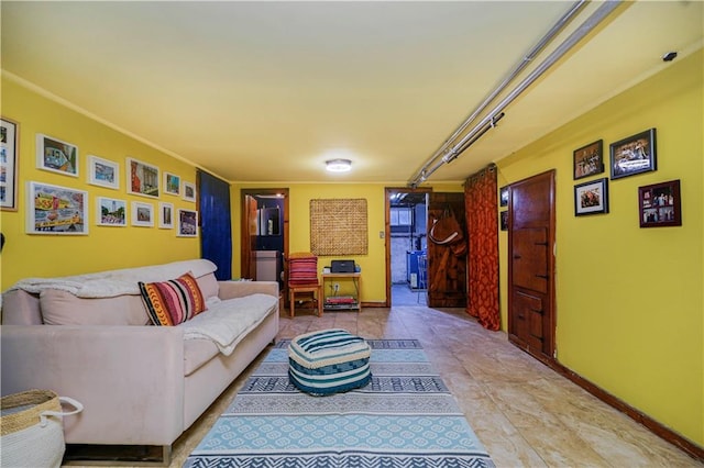 living area featuring light tile patterned flooring and baseboards