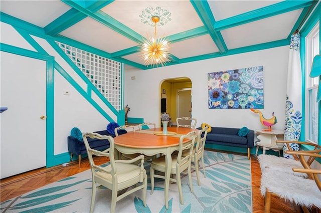 dining area with beamed ceiling, a notable chandelier, arched walkways, and coffered ceiling