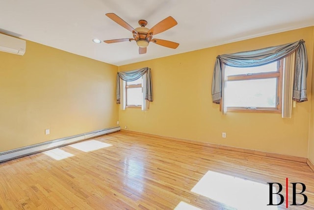 unfurnished room featuring ceiling fan, a baseboard radiator, an AC wall unit, and wood finished floors