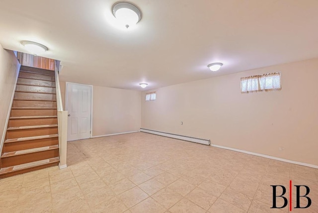 basement with stairway, light floors, baseboards, and baseboard heating