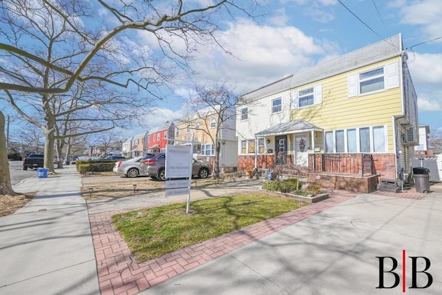 view of front of home featuring brick siding