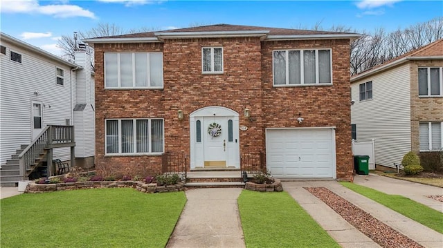 view of front of property featuring a garage, a front yard, brick siding, and driveway