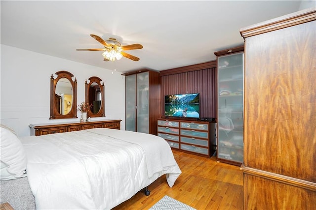 bedroom featuring ceiling fan and light wood-style floors