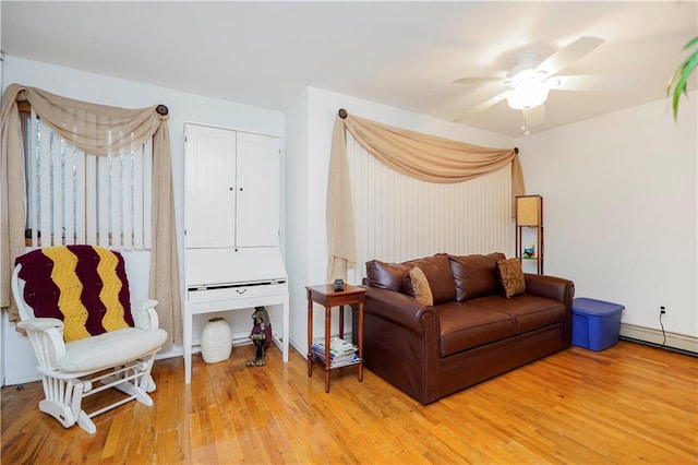 living area featuring ceiling fan and wood finished floors