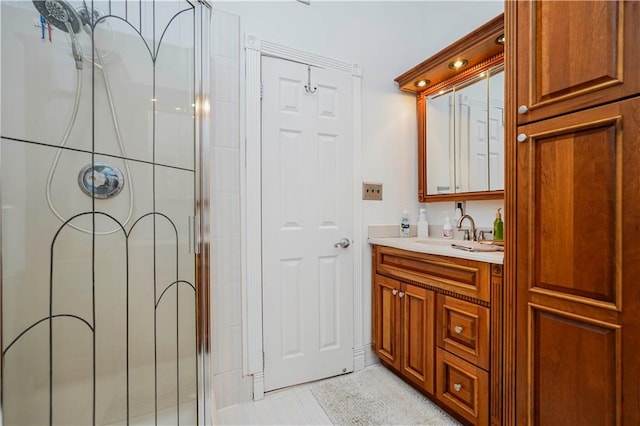 full bath with vanity and a shower stall