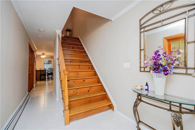 stairs with a baseboard heating unit, baseboards, ornamental molding, and a ceiling fan