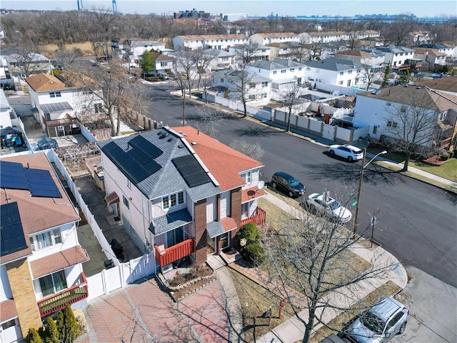 birds eye view of property with a residential view