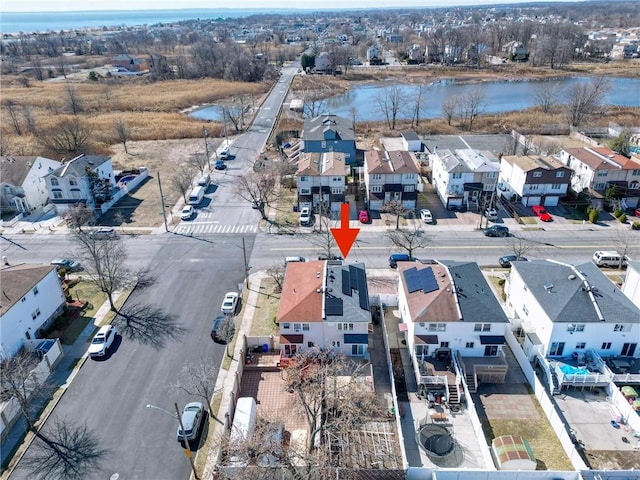 bird's eye view with a residential view and a water view