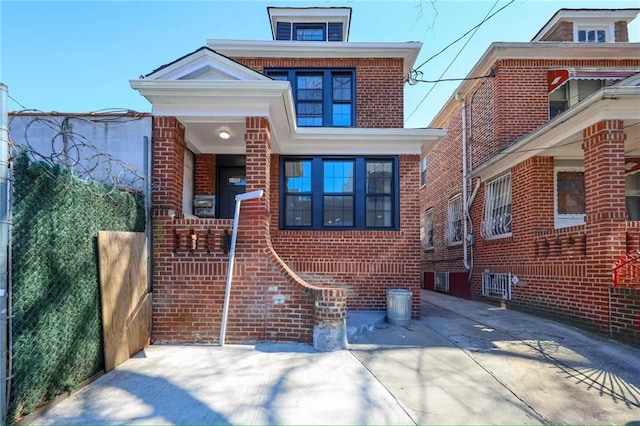 view of front of house featuring brick siding