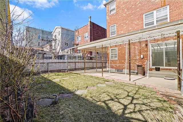 view of yard featuring a patio area and fence