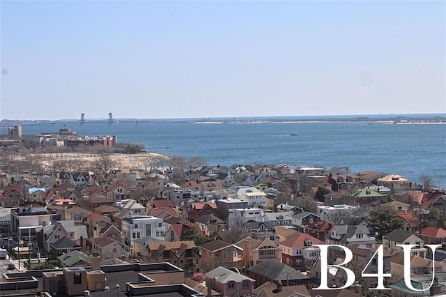 birds eye view of property featuring a residential view and a water view