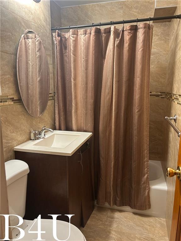 full bath with vanity, toilet, and shower / bathtub combination with curtain