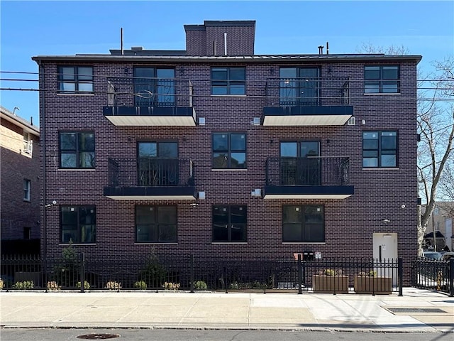 view of building exterior featuring fence