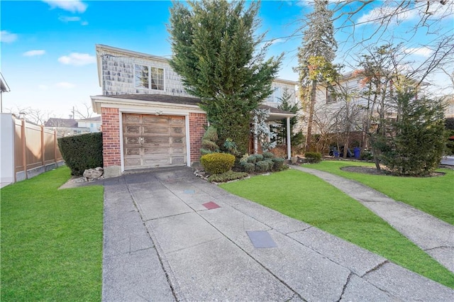 view of front of house featuring a front lawn, concrete driveway, fence, and brick siding