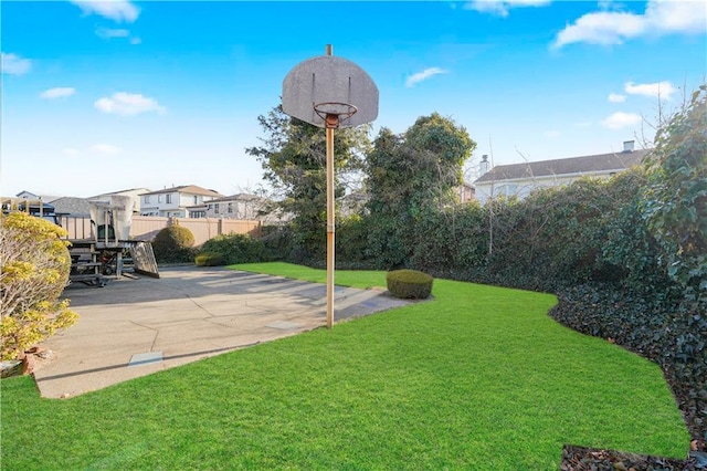 view of yard with a patio and fence