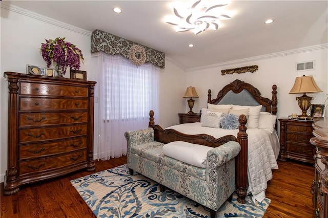 bedroom with visible vents, recessed lighting, crown molding, and wood finished floors