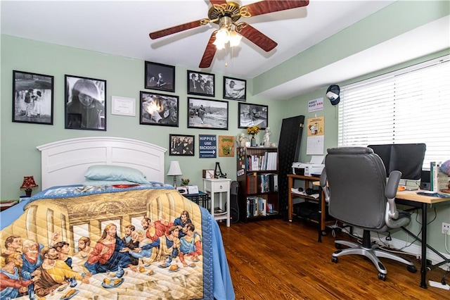 bedroom with ceiling fan and wood finished floors