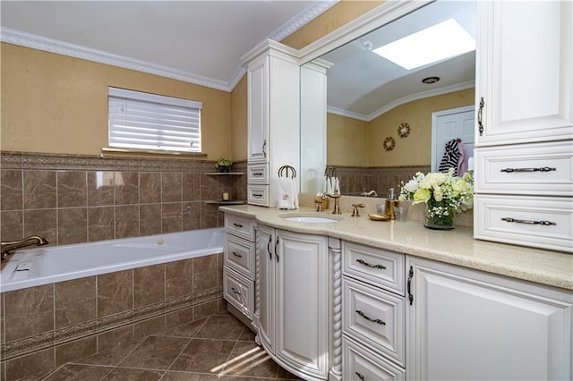 full bath featuring tile patterned flooring, crown molding, a garden tub, a skylight, and vanity