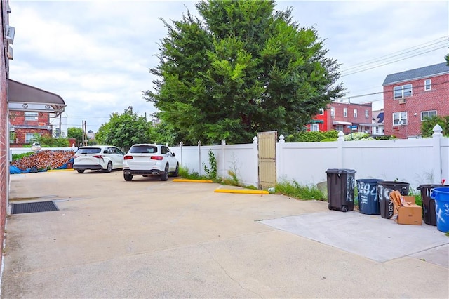 uncovered parking lot with fence