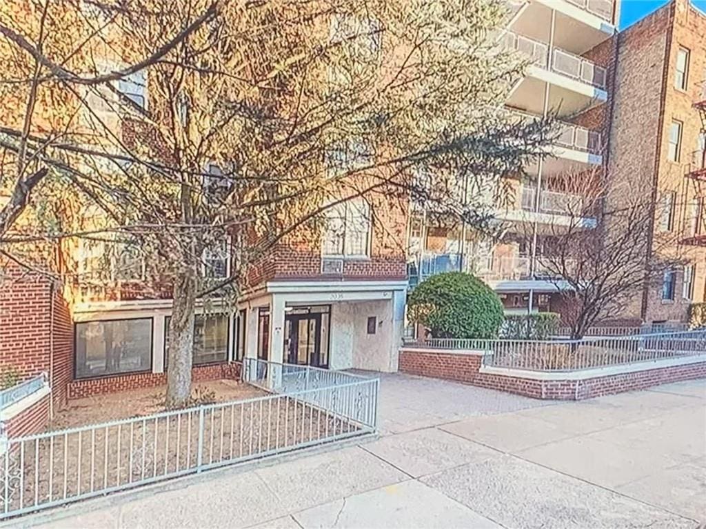 2035 E 7th St Unit 3J, Brooklyn, NY 11223 - view of building exterior with a fenced front yard