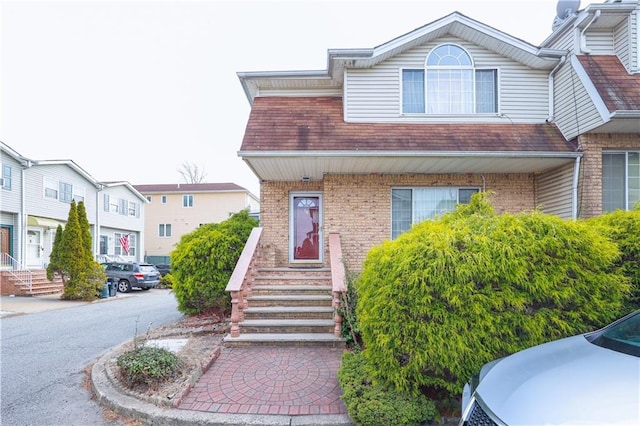 view of front of house featuring brick siding