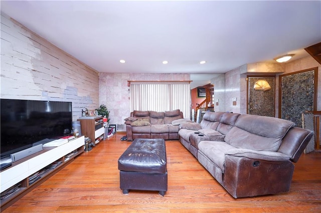 living area featuring wood finished floors and recessed lighting