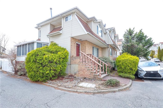 view of front of home featuring brick siding