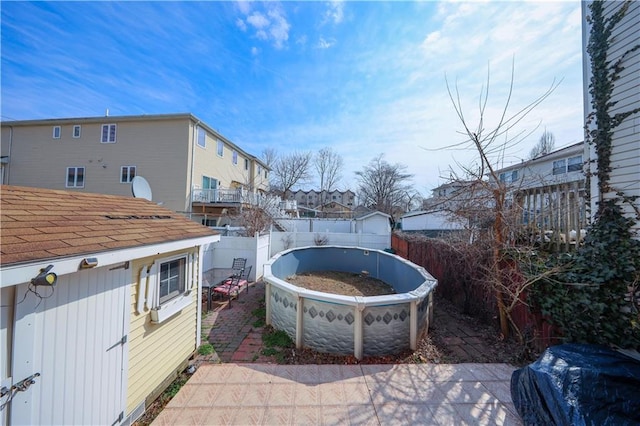 view of patio / terrace with a residential view and a fenced backyard