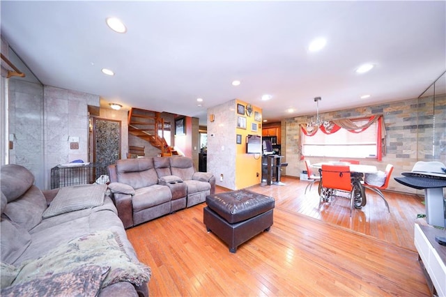 living room with stairway, light wood finished floors, and recessed lighting