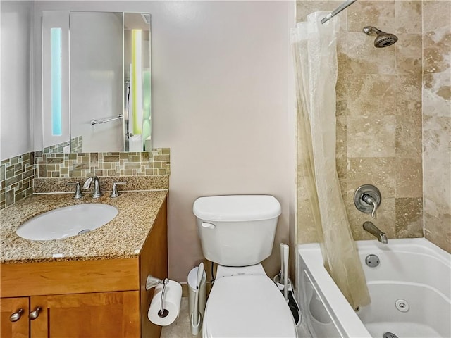 bathroom featuring decorative backsplash, toilet, vanity, and a combined bath / shower with jetted tub