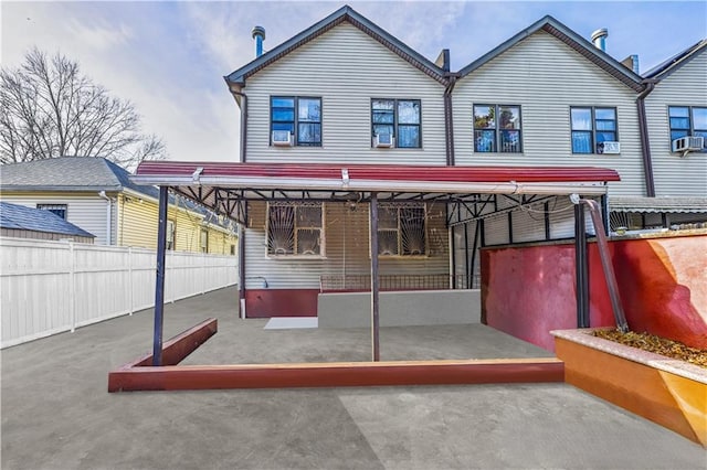 back of house with a patio area, cooling unit, and fence